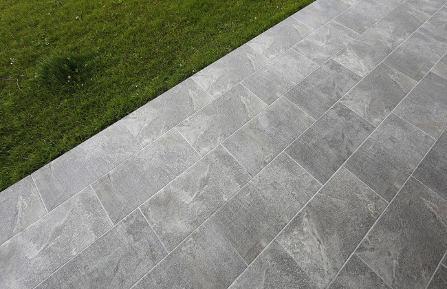 Renovation of exterior stone terrace with tile installation in Hendaye