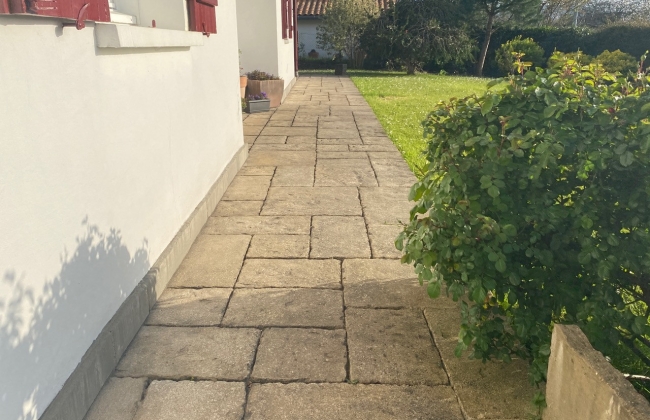 Renovation of exterior stone terrace with tile installation in Hendaye