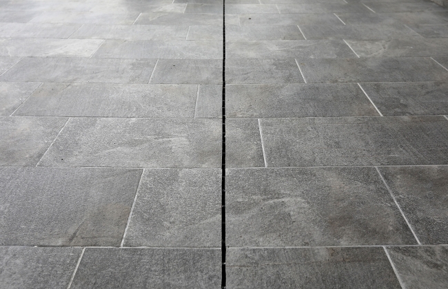 Renovation of exterior stone terrace with tile installation in Hendaye