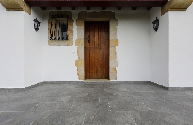 Renovation of exterior stone terrace with tile installation in Hendaye