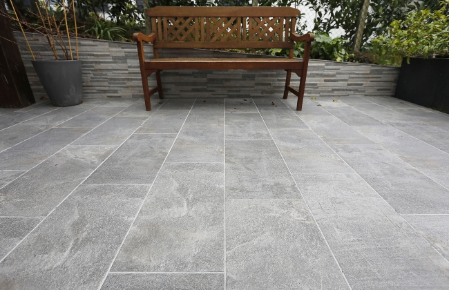 Renovation of exterior stone terrace with tile installation in Hendaye