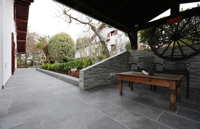Renovation of exterior stone terrace with tile installation in Hendaye