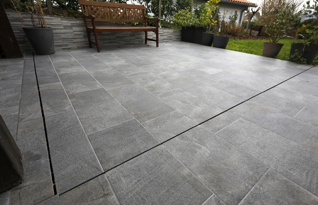 Renovation of exterior stone terrace with tile installation in Hendaye